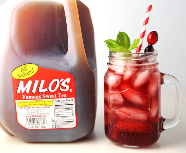 #ad - Cranberry Ginger Iced Tea made with Milo's Sweet Tea. This is the perfect holiday drink for your next party! #PassTheMilos #Pmedia 