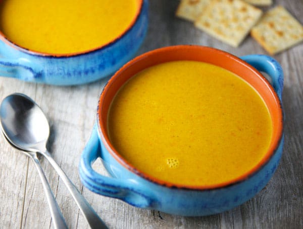 This Coconut Curry Carrot Ginger Soup is super easy to make and is loaded with flavor! Plus it's Vegan and Gluten Free!