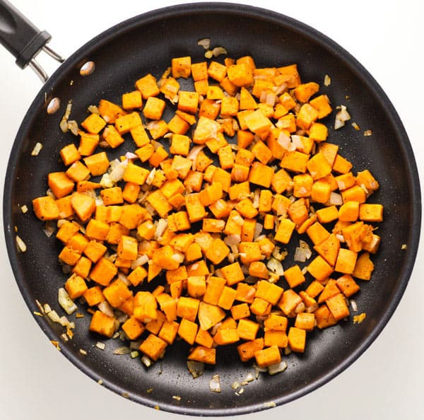 cooked sweet potatoes in a pan