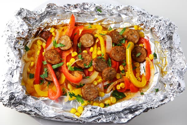 #ad Cajun Sausage and Peppers Foil Packets ~ Just add everything to a foil packet and bake or grill! | Tastefulventure.com made in partnership with Old Bay #IdOLDBAYThat