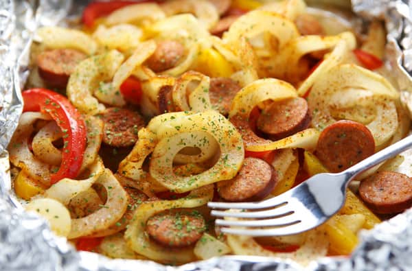 #ad - These Cajun Spiralized Potatoes and Sausage Foil Packets come together in 15 minutes! Just add everything to a foil packet and bake or grill, this makes for easy cleanup too! | tastefulventure.com made in partnership with @PotatoGoodness #Potatoes #CLVR