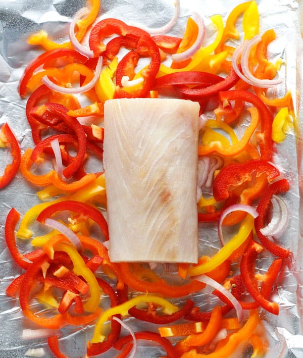 #ad Coconut Curry Mahi Mahi with Peppers ~ This is so easy, just add everything to a foil packet and bake or grill! The fish comes out perfectly flaky and full of flavor with the Peppers and Coconut Curry sauce! | Tastefulventure.com made in partnership with @freshfromflorida #IC #FreshFromFlorida