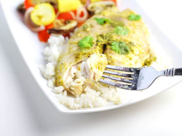 This Coconut Curry Tilapia With Zucchini Medley is so easy to make! Just add everything to a foil pack and bake or grill for a fresh healthy meal! 