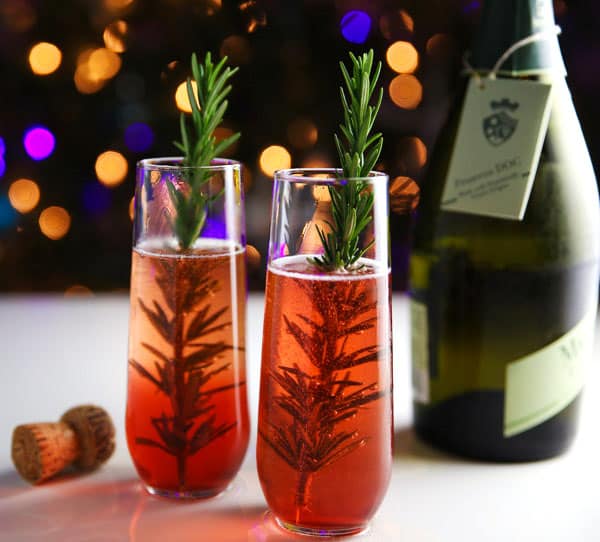 Cranberry Rosemary and Prosecco Cocktail - This is the perfect Holiday Cocktail and is so easy to make!