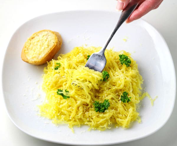 This Garlic Parmesan Spaghetti Squash is super easy to make and tastes so delicious! This is a great Gluten Free alternative to regular noodles.