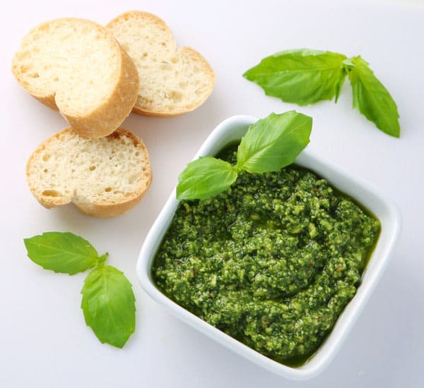 How To Make Basil Pesto - This is so easy to make and tastes so delicious! Dip your favorite bread in it, add it to pizza, or mix in with pasta!