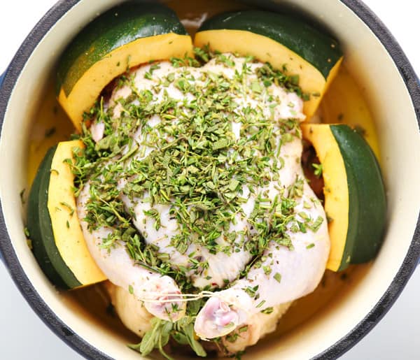 This Lemon-Herb Roasted Chicken With Acorn Squash is so tender, juicy, and full of flavor! 