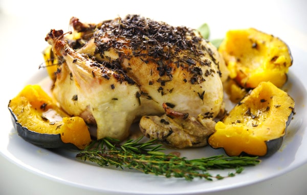 This Lemon-Herb Roasted Chicken With Acorn Squash is so tender, juicy, and full of flavor! 