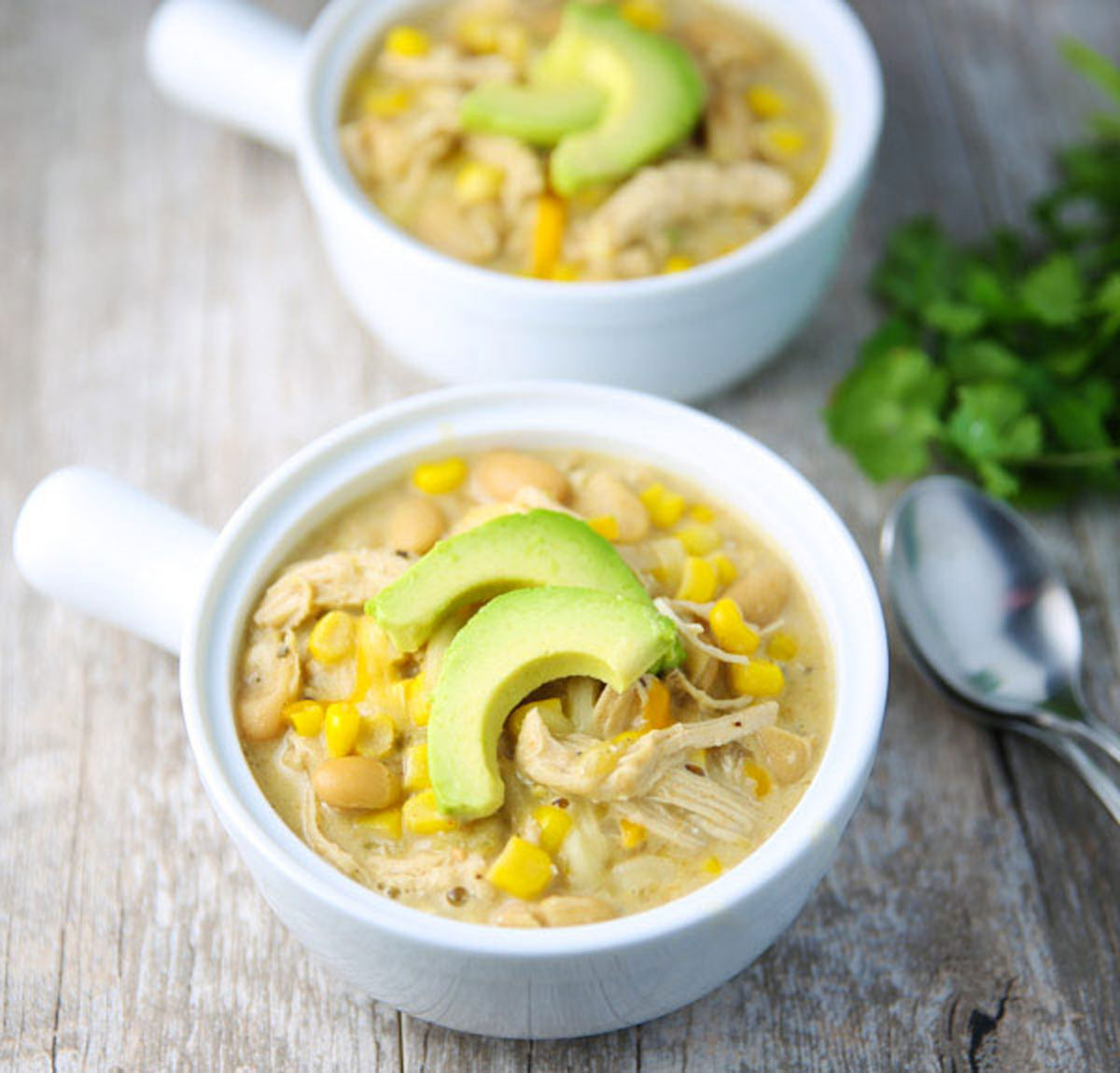 White Chicken Chili in a bowl with avocado