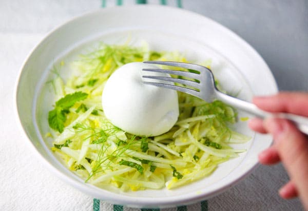 Cutting burrata with a fork