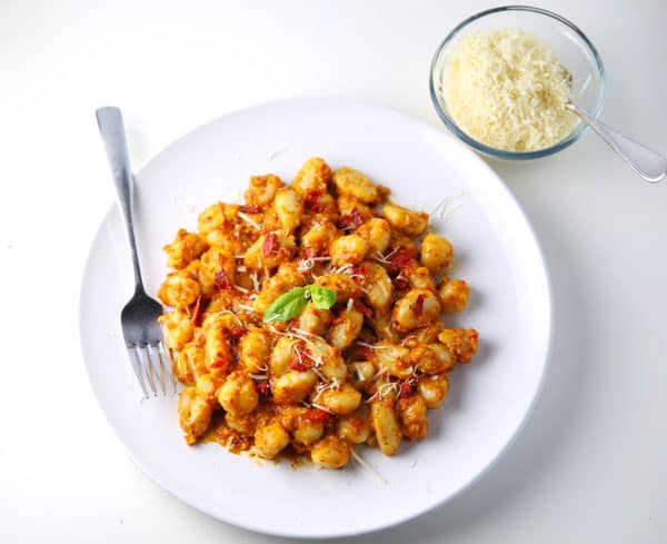This Sun-Dried Tomato Pesto Gnocchi (Gluten Free) can be made in less than 10 minutes and is so delicious! Perfect for those busy week nights!