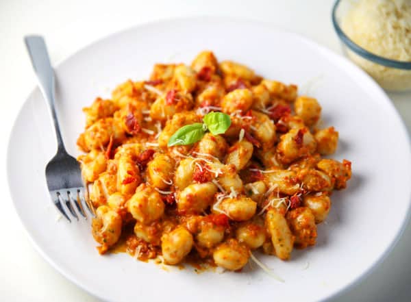 This Sun-Dried Tomato Pesto Gnocchi (Gluten Free) can be made in less than 10 minutes and is so delicious! Perfect for those busy week nights!