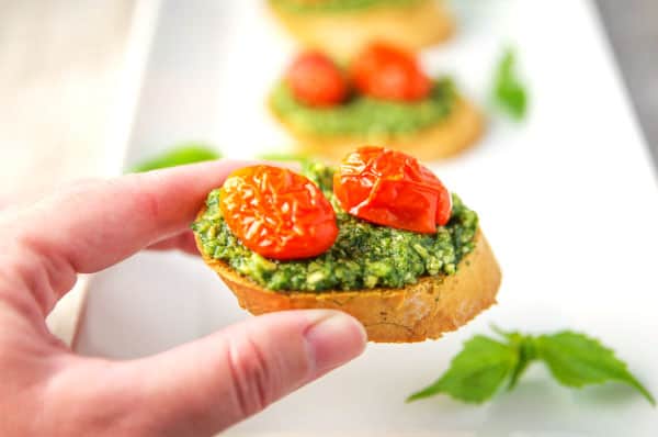 These Basil Pesto Crostini with Roasted Tomatoes are such an easy appetizer to make and a crowd favorite!