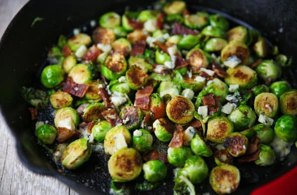 These Brussels Sprouts with Bacon and Gorgonzola could be the perfect side dish! The Brussels get cooked right in the Bacon grease, then with the mixed in Gorgonzola, this is absolutely drool worthy!