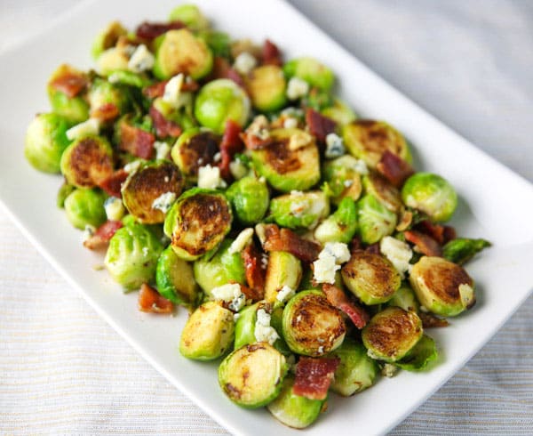 These Brussels Sprouts with Bacon and Gorgonzola could be the perfect side dish! The Brussels get cooked right in the Bacon grease, then with the mixed in Gorgonzola, this is absolutely drool worthy!