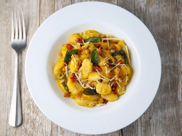This Butternut Squash Gnocchi with Pancetta and Sage comes together in less than 10 minutes! It's so creamy, comforting, and savory! #glutenfree