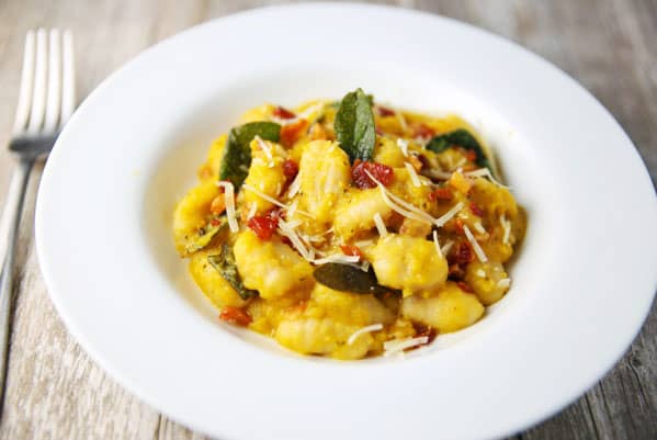 This Butternut Squash Gnocchi with Pancetta and Sage comes together in less than 10 minutes! It's so creamy, comforting, and savory! #glutenfree