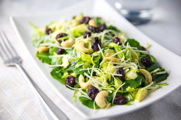 This Kale Brussels Cranberry Cashew Salad is so light, healthy, and full of flavor! 