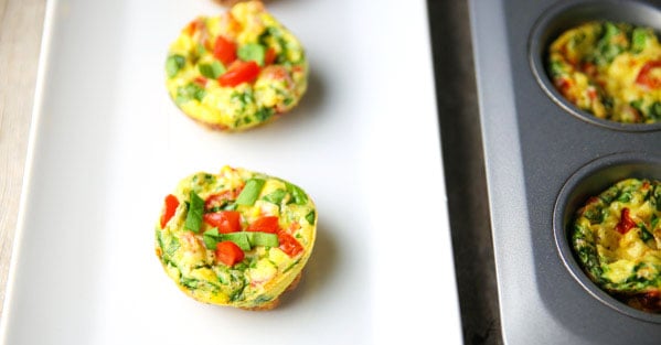 These Spinach Tomato Egg Muffins with Fontina Cheese are super easy to make and are loaded with flavor! Perfect for making ahead, just heat and eat the next day for breakfast on the go!