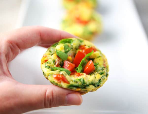 These Spinach Tomato Egg Muffins with Fontina Cheese are super easy to make and are loaded with flavor! Perfect for making ahead, just heat and eat the next day for breakfast on the go!