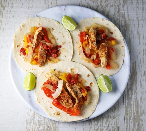 These Slow Cooker Chicken Fajitas are so easy to make and loaded with flavor! Perfect for those busy weeknights!