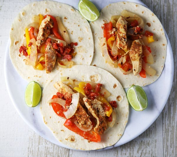 These Slow Cooker Chicken Fajitas are so easy to make and loaded with flavor! Perfect for those busy weeknights!