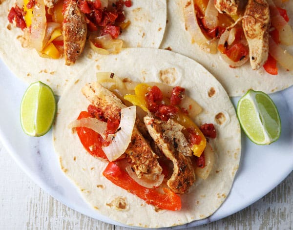 These Slow Cooker Chicken Fajitas are so easy to make and loaded with flavor! Perfect for those busy weeknights!