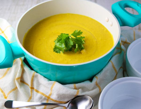 This Coconut Squash Soup with Turmeric and Ginger is so luscious, creamy, and flavorful! This soup is true comfort food! #coconut #squash #soup #vegetarian #glutenfree