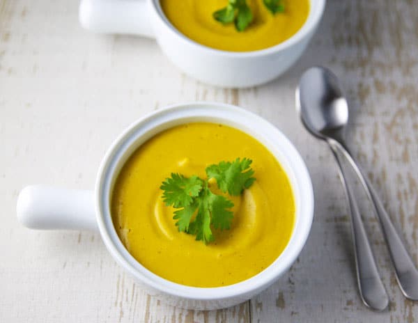 This Coconut Squash Soup with Turmeric and Ginger is so luscious, creamy, and flavorful! This soup is true comfort food! #coconut #squash #soup #vegetarian #glutenfree