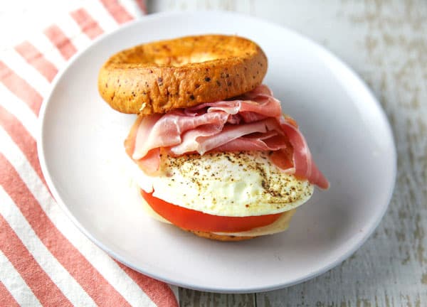 Breakfast just got a whole lot better with this Prosciutto Provolone Tomato and Egg Breakfast Bagel! #glutenfree #breakfast #brunch #bagel #breakfastbagel