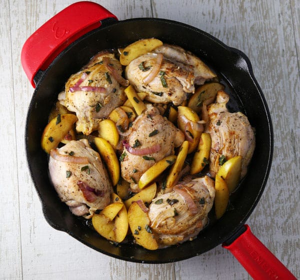 These Skillet Apple Chicken Thighs are an easy peasy weeknight dinner! The Chicken is so tender, juicy, and savory!