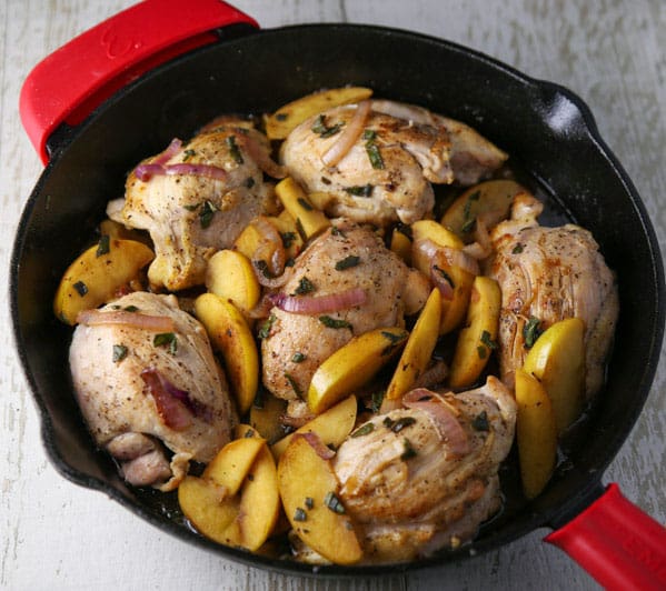 These Skillet Apple Chicken Thighs are an easy peasy weeknight dinner! The Chicken is so tender, juicy, and savory!