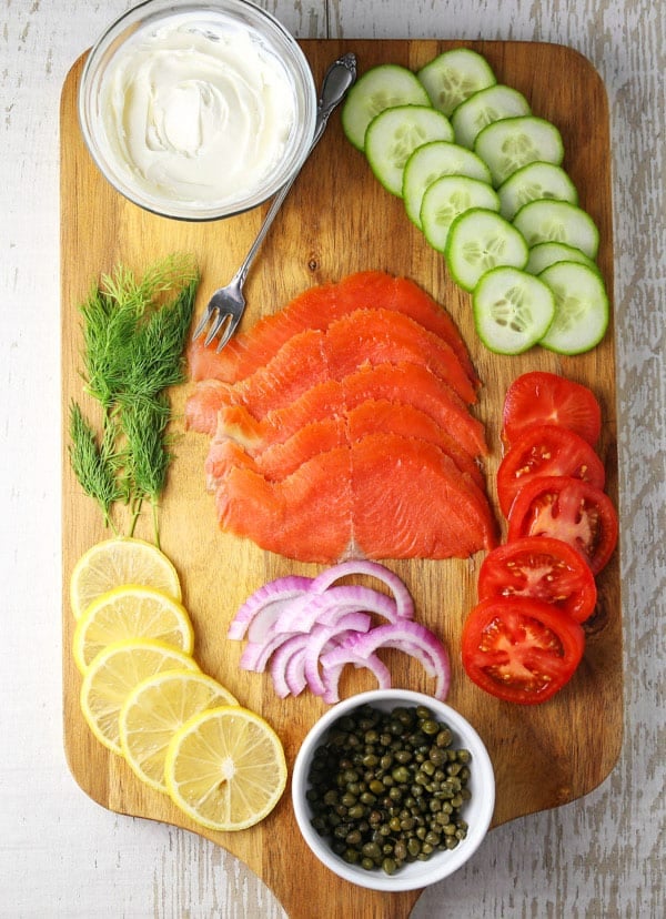 Up your Brunch Game with this Smoked Salmon Brunch Board! This is super easy to put together at the last minute and can feed a crowd! #salmon #smokedsalmon #brunch #breakfast #charcuterie #appetizer #partyideas