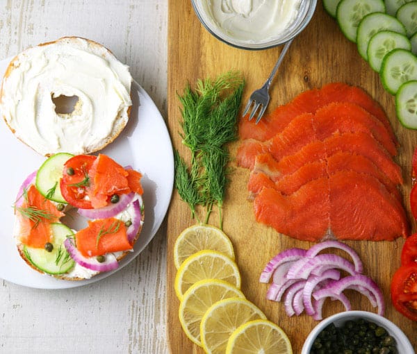 Up your Brunch Game with this Smoked Salmon Brunch Board! This is super easy to put together at the last minute and can feed a crowd! #salmon #smokedsalmon #brunch #breakfast #charcuterie #appetizer #partyideas