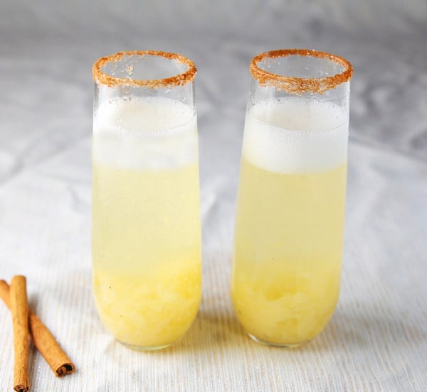 This Spiced Pear Bellini is so light, refreshing, and festive! This is a super easy cocktail to make and is so versatile. You could have this for Brunch, with Appetizers, or even Dessert! #bellini #prosecco #cocktails #cocktail #entertaining #brunch #drinks