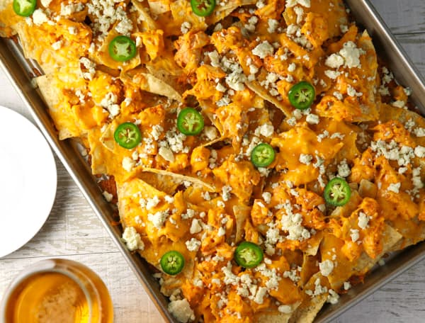 These Sheet Pan Buffalo Chicken Nachos are LOADED with flavor! They will definitely be a hit at your next party! #buffalochickennachos #buffalochicken #chicken #nachos #appetizer #appetizers #glutenfree #gameday