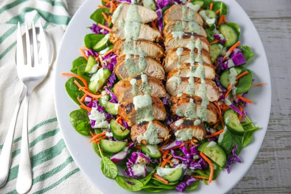 This Grilled Chili Lime Chicken Salad is so incredibly delicious! We used a super simple marinade for the chicken, which comes out perfectly tender and juicy once grilled! #grilling #grill #grilled #chicken #salad #glutenfree