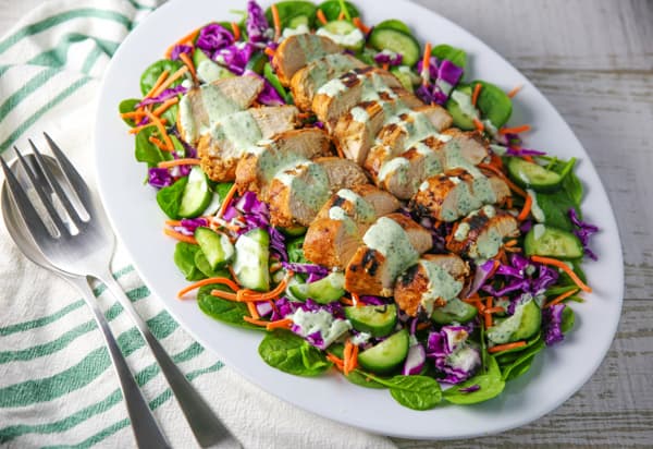 This Grilled Chili Lime Chicken Salad is so incredibly delicious! We used a super simple marinade for the chicken, which comes out perfectly tender and juicy once grilled! #grilling #grill #grilled #chicken #salad #glutenfree