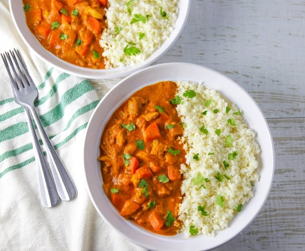 This Spicy Chicken Curry with Cauliflower Rice comes together in about 30 minutes and is loaded with flavor! #lowcarb #glutenfree #chicken #curry #cauliflowerrice #dinner