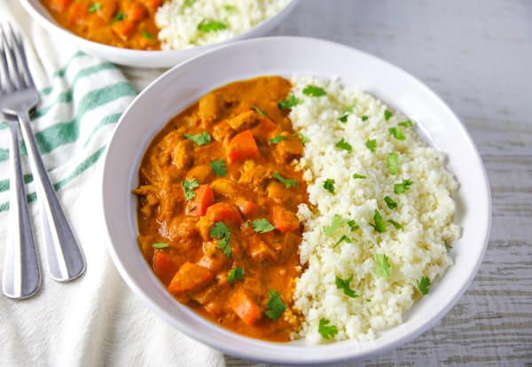 This Spicy Chicken Curry with Cauliflower Rice comes together in about 30 minutes and is loaded with flavor! #lowcarb #glutenfree #chicken #curry #cauliflowerrice #dinner