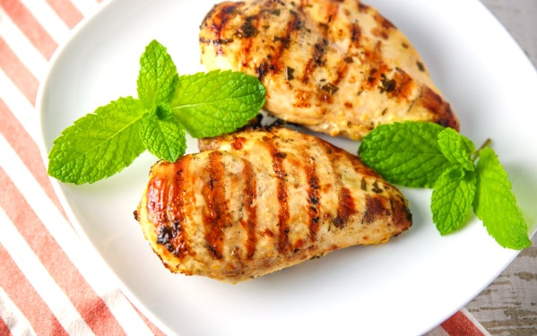 These Grilled Lemon Mint Chicken Breasts are made with a simple marinade with ingredients you probably already have on hand. The Chicken is so tender, juicy, and 100% savory! #grilled #chicken #lowcarb #glutenfree #keto