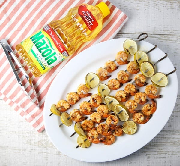 ad - Today I put together an easy peasy grilling recipe for these Grilled Chili Lime Shrimp Kabobs! This is a super easy recipe that everyone is sure to love! #MyMazolaMarinade #shrimp #kabobs #grilled