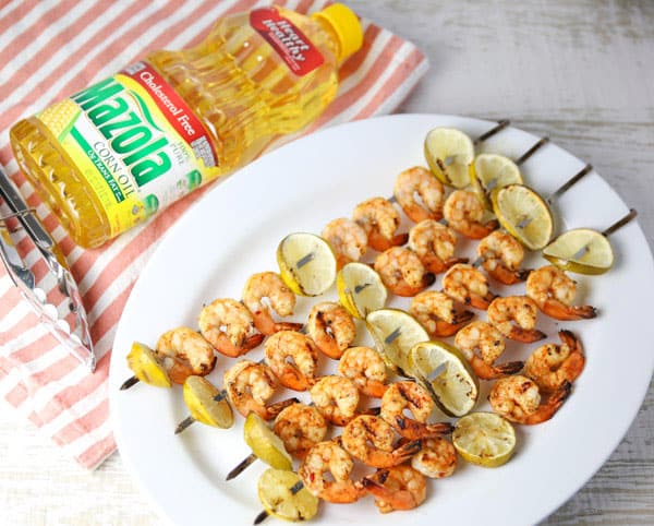 ad - Today I put together an easy peasy grilling recipe for these Grilled Chili Lime Shrimp Kabobs! This is a super easy recipe that everyone is sure to love! #MyMazolaMarinade #shrimp #kabobs #grilled