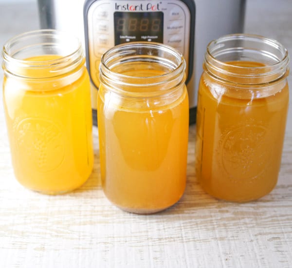 Here's how to make Instant Pot Chicken Stock the easy way. This only takes 30 minutes in the Instant Pot, and you get a super savory Chicken Stock which is way better than any store bought! #InstantPot #chickenstock, #chickenbroth, #soup, #glutenfree