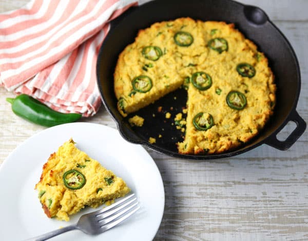 This Skillet Jalapeño Cornbread is super easy to make. It literally only requires 5 minutes of prep work! It's loaded with Jalapeños which gives it a nice spicy kick! #glutenfree #jalapeno #cornbread #southern