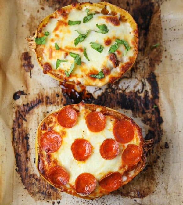 Cooked Spaghetti Squash Pizza boats on a baking sheet