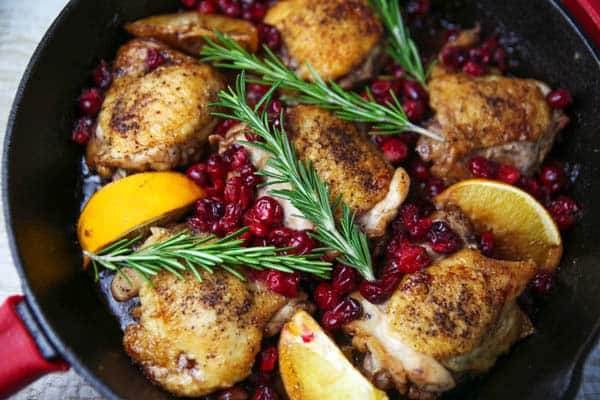 Cranberry Orange Chicken Thighs with Rosemary closeup in skillet