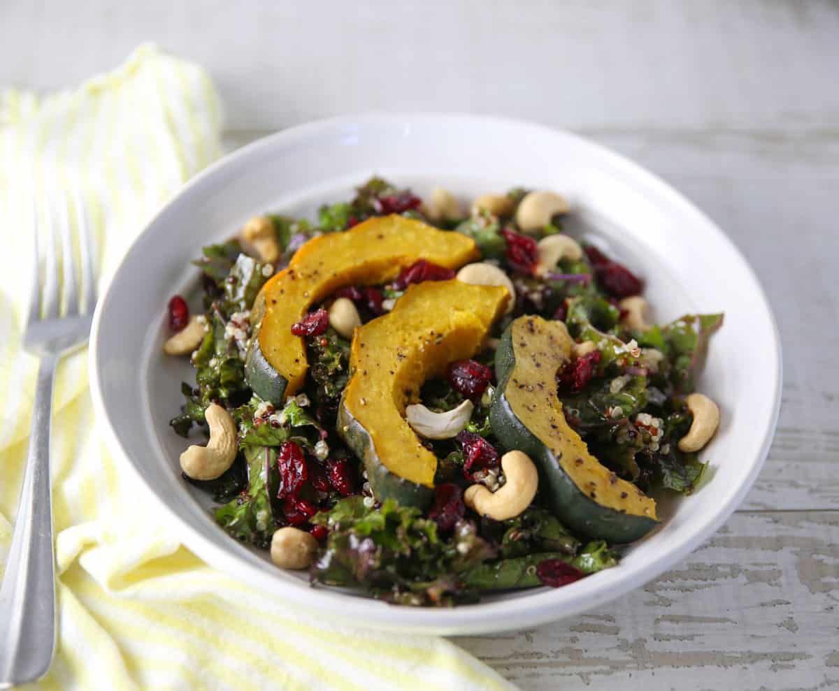 kale quinoa salad with roasted squash in a bowl