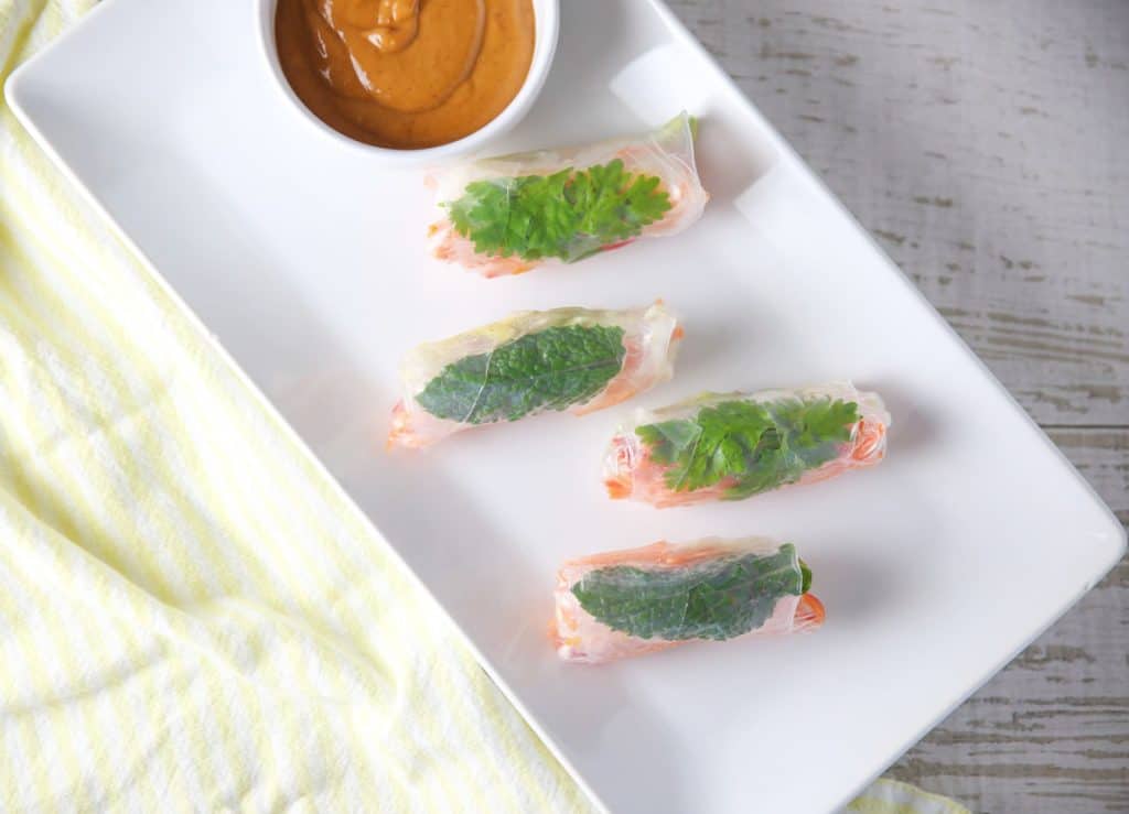 veggie spring rolls with spicy peanut sauce on a plate