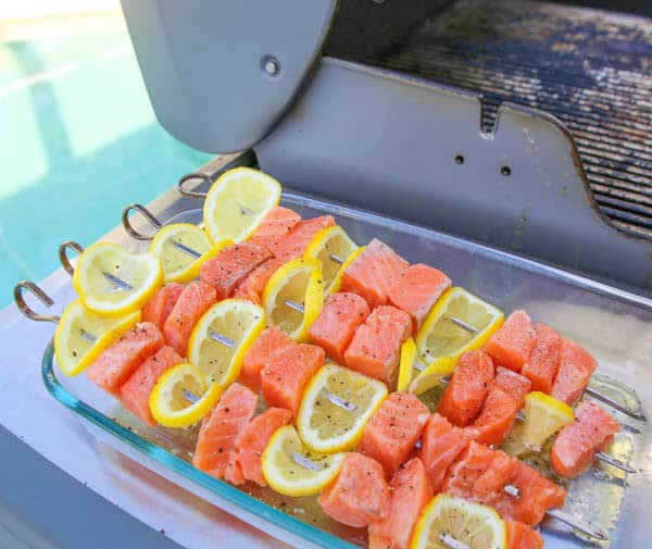 Lemon Salmon Skewers next to the grill